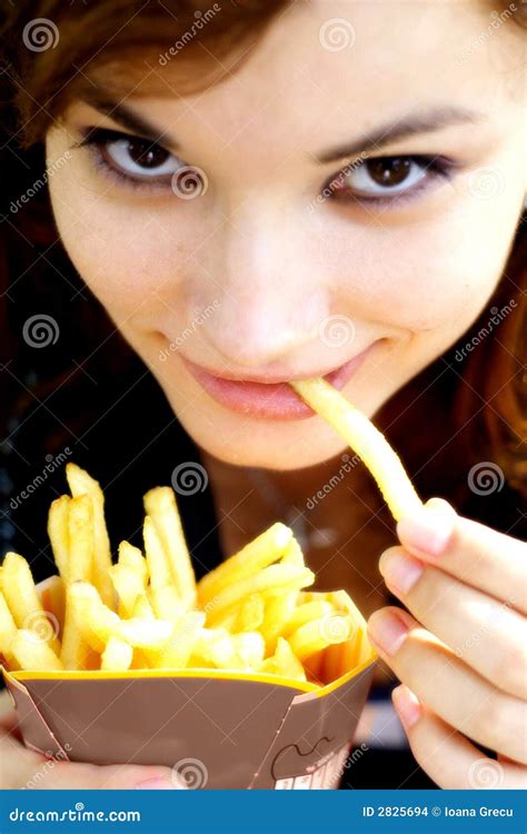 Woman Eating French Fries