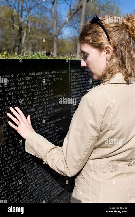 Tourist Looks At The Names On The Maya Lin S Vietnam Veterans Memorial Washington D C United