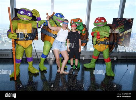 New York Usa 24th July 2023 Visitors Pose With Comic Book And Movie Characters The ‘teenage