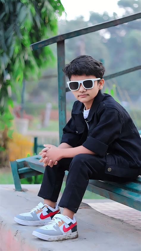 boy playing  swing  playground  stock photo