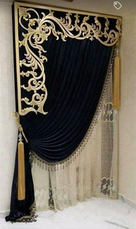 A Black And Gold Curtain With Tassels Hanging From Its Side In Front