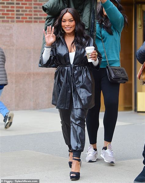 Angela Bassett 61 Stuns In Leather Ensemble As Her Stylist Protects Her Flawless Hair In Nyc