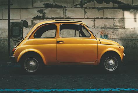 Hd Wallpaper Yellow Fiat 500 3 Door Hatchback Parked Beside Wall Car