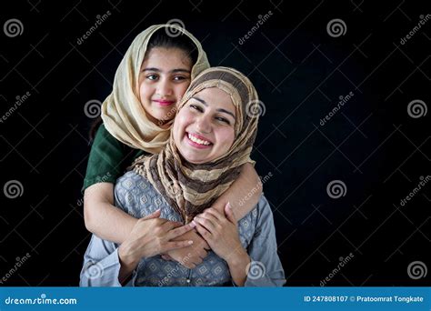 Portrait Of Smiling Pakistani Muslim Woman With Daughter Adorable