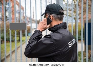 Confident Mature Security Guard Talking On Foto De Stock 363129746