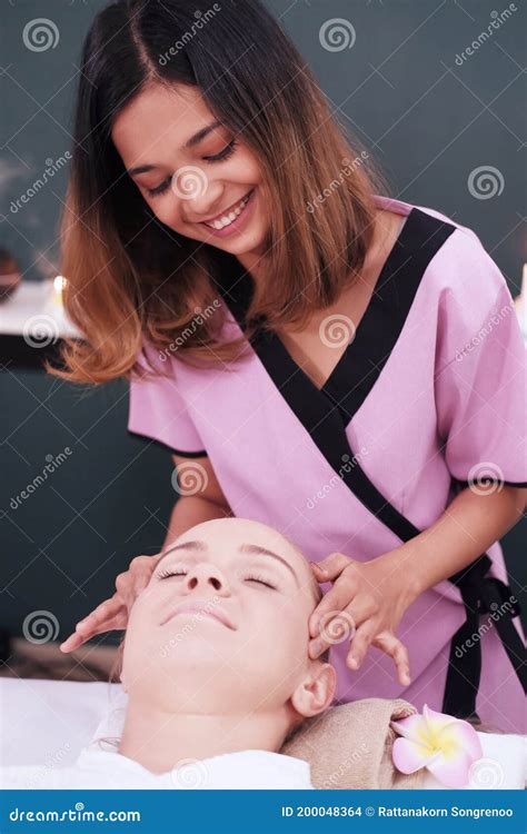 Smiling Professional Asian Thai Massage Therapist Woman Is Making