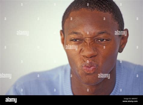 Male, black man, 20-30 makes face, wrinkles nose Stock Photo - Alamy