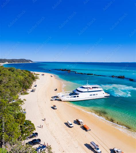 4WD vehicles and ferry on Moreton Island Stock Photo | Adobe Stock