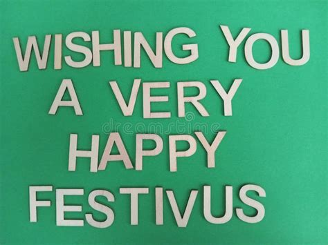 Wishing You A Very Happy Festivus Sign On A Green Background Stock