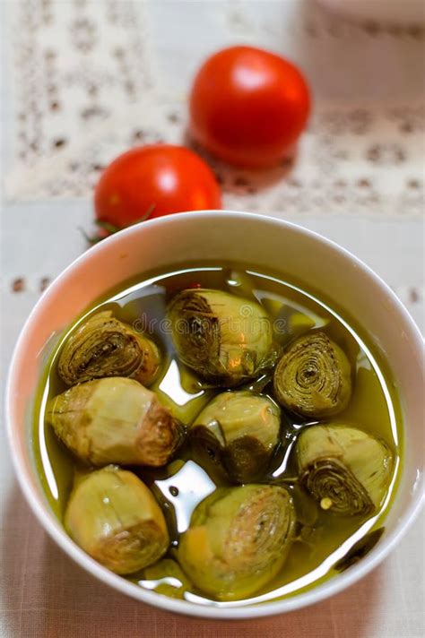 Italian Food Pickled Drilled Artichokes Hearts In Olive Oil Stock