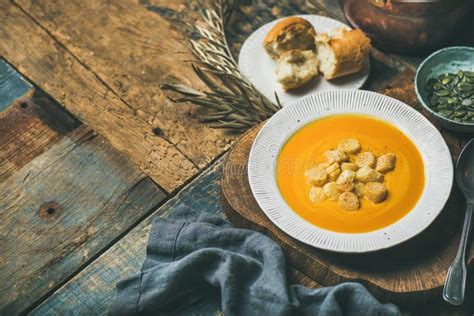 Fall Warming Pumpkin Cream Soup with Seeds and Bread Croutons Stock ...