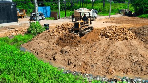 Hard Working Komatsu Bulldozer Spreading Soil On Road Foundation With 5