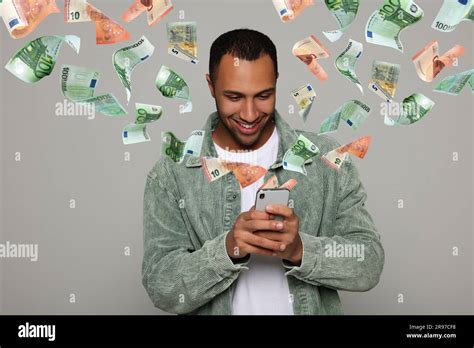 Online Payment Man Buying Something Using Mobile Phone On Light Grey