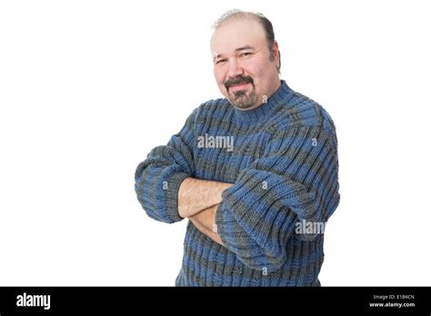 Portrait Of A Friendly Mature Man With Arms Crossed On A White