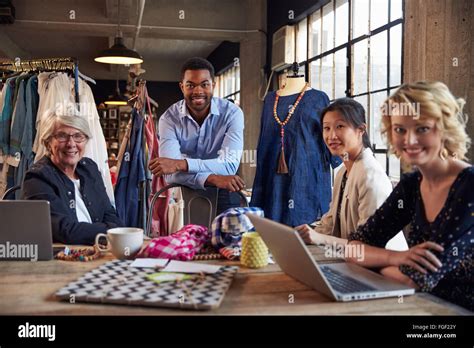 Portrait Of Four Fashion Designers In Meeting Stock Photo Alamy