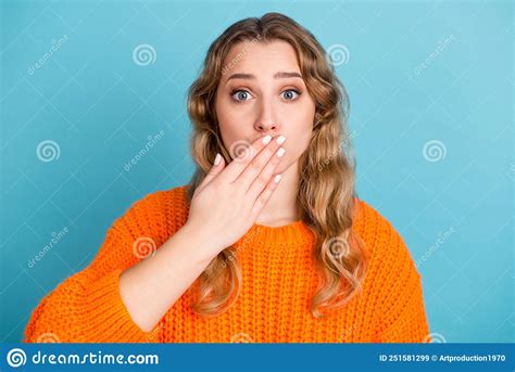 Shocked Amazed Young Woman Standing Covering Mouth With Hands Looking