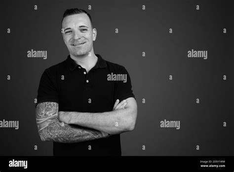 Man Wearing Black Shirt Against Gray Background Stock Photo Alamy
