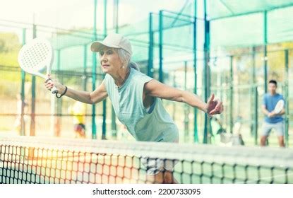 Sporty Mature Woman Padel Player Hitting Stock Photo 2200733095