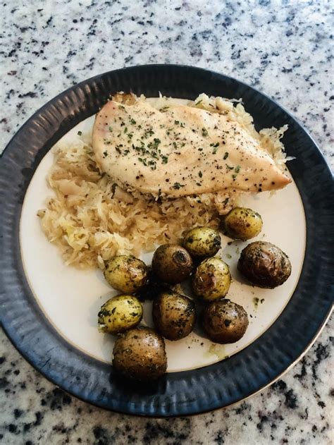 Slow Cooked Chicken And Sauerkraut With A Side Of Rosemary Potatoes Tonightsdinner