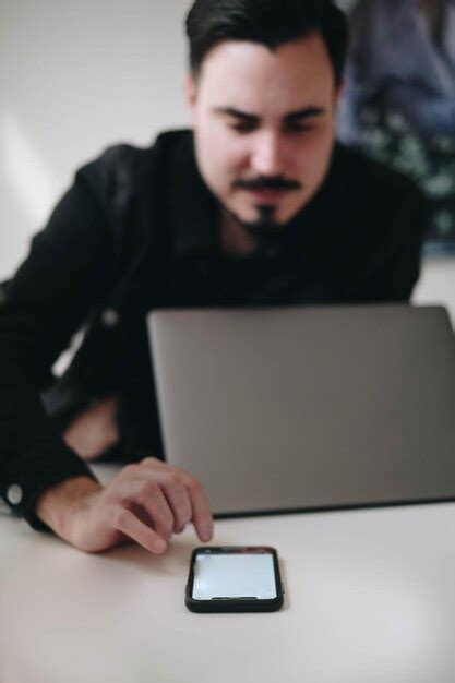 Premium Photo Businessman Using Mobile Phone While Sitting By Table