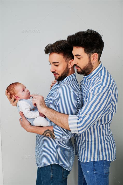A Gay Couple With Their Son Gay Parents Concept Stock Photo By Alvarogonzalez