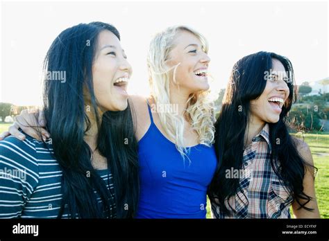 Women laughing outdoors Stock Photo - Alamy