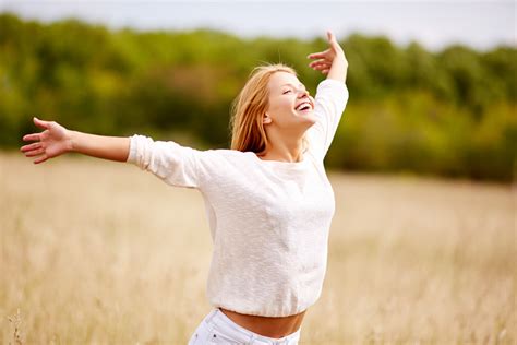 Image Of Happy Woman With Outstretched Arms Standing In Field Royalty