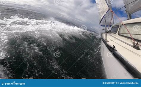 Sailboat Hull Cutting Through Water Bending On The Side Through Stormy