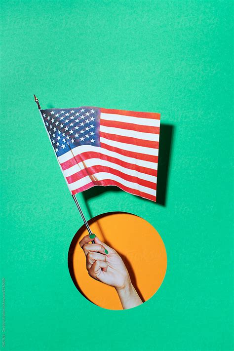 Hand Holding A Usa Flag By Stocksy Contributor CACTUS Creative