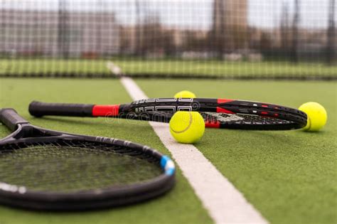 Tennis Court Top View Tennis Balls And Racket On The Green Grass