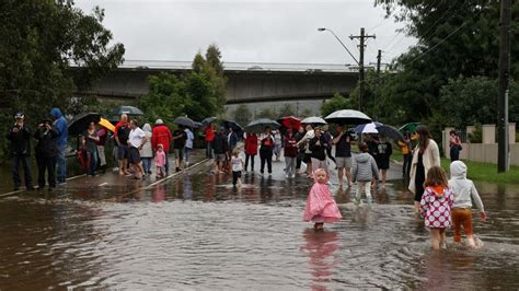 Australia flash floods: 18,000 evacuated and hundreds rescued as floodwaters cut off communities ...