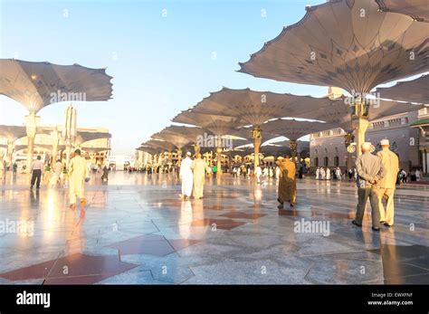 MEDINA SAUDI ARABIA MARCH 06 2015 Pilgrims Walk Underneath Giant