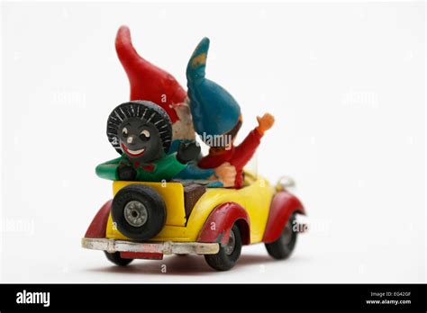 Noddy Driving His Car With Big Ears And Golly Sitting In The Back Stock