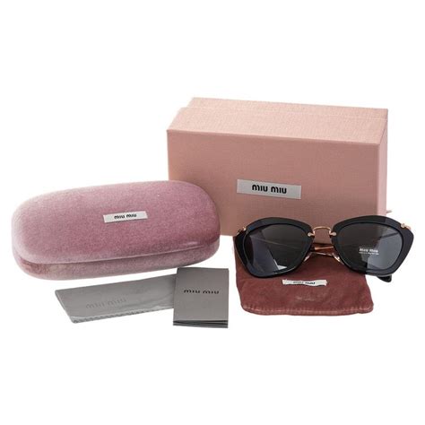 Miu Miu Goldblack Smu 10n Cat Eye Sunglasses At 1stdibs