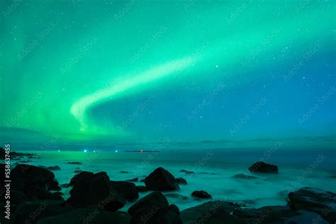 Aurora Borealis Northern Lights Above The Sea At Uttakleiv Beach