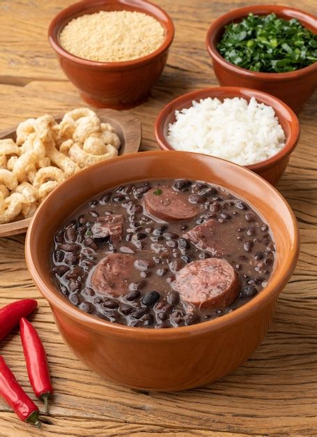 Premium Photo Typical Brazilian Feijoada With Rice Kale Farofa And