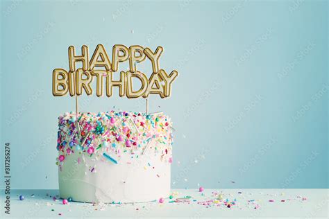 Birthday cake with happy birthday banner Stock Photo | Adobe Stock