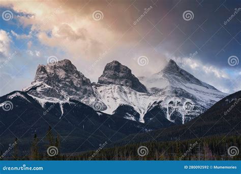 Sunrise Over Three Sisters Mountains In Banff National Park At Canmore