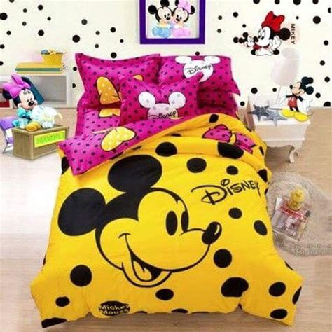 A Bedroom With Mickey Mouse Bedding And Polka Dot Wallpaper