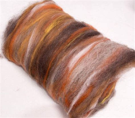 An Orange And Brown Colored Yarn Spool