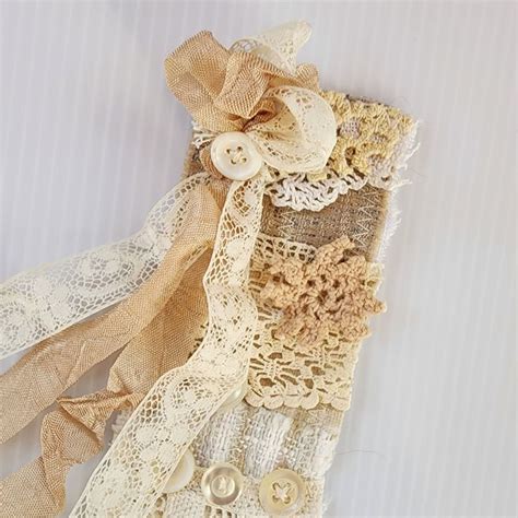 Neutral X Snippet Roll With Lace Doily Pieces And Buttons Textile