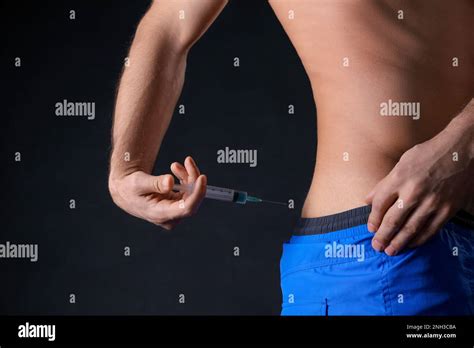 man injecting   black background closeup doping concept