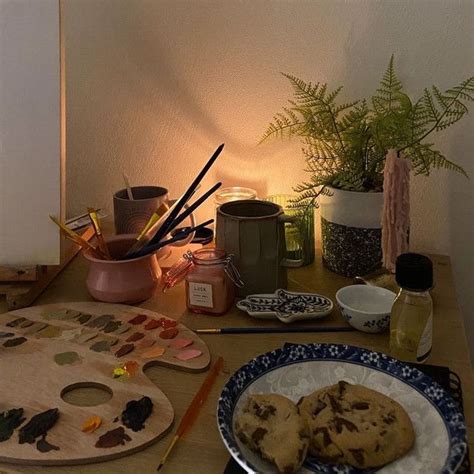 A Wooden Table Topped With Plates And Bowls Filled With Cookies Next To