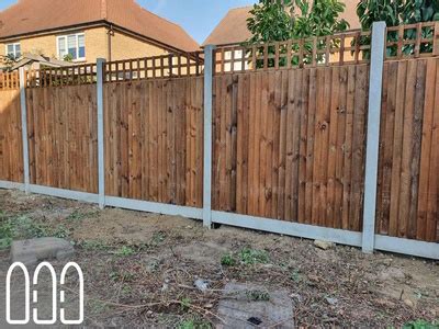 Close Board Fencing With Concrete Posts And Gravel Boards And A Box Trellis