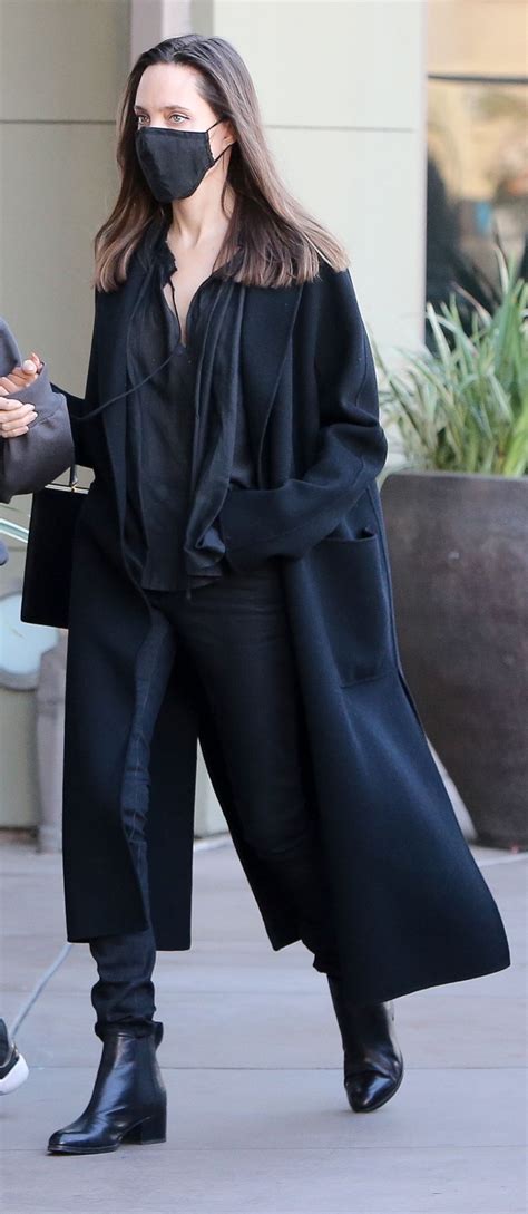 Angelina Jolie Stuns In A Sheer Shirt Skinny Jeans And Leather Boots Flipboard