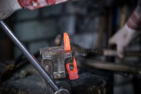 Workspace Of Blacksmith Blacksmith Working With Red Hot Metal Workpiece Of New Hammer In The