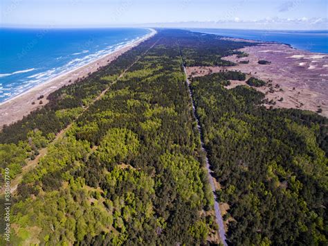 Aerial view with dunes, forest and sea in Curonian spit on a sunny day ...