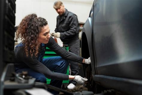 Free Photo Side View Woman Repairing Car