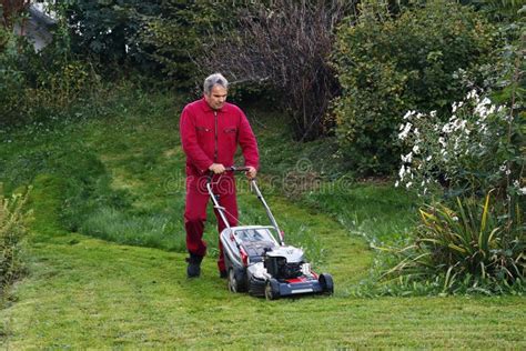 A Man Mowing The Lawn Stock Image Image Of Cutting 128175653