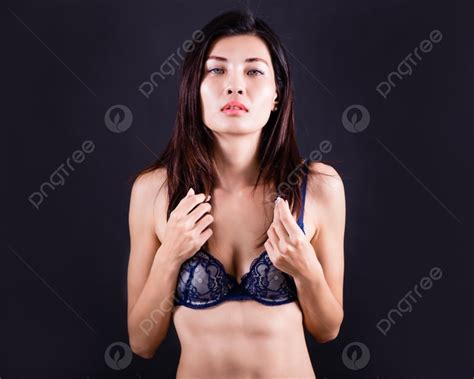 Chinese Asian Woman Wearing Blue Bra On Dark Background Photo And